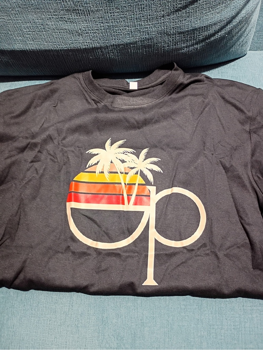 Black Unisex Ocean Pacific Op Graphic Tee with Sunset Palm Design